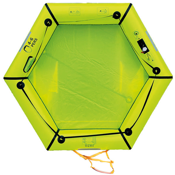 Tasken åbnet med redningsflåden synlig, klar til opsætning.